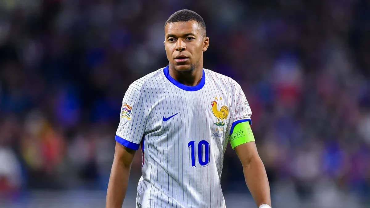 Kylian Mbappé wearing France jersey during match