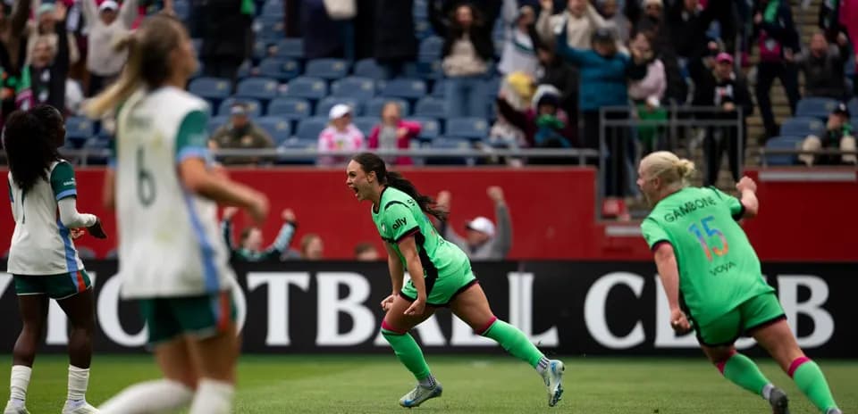 Player celebrating a goal during NWSL match