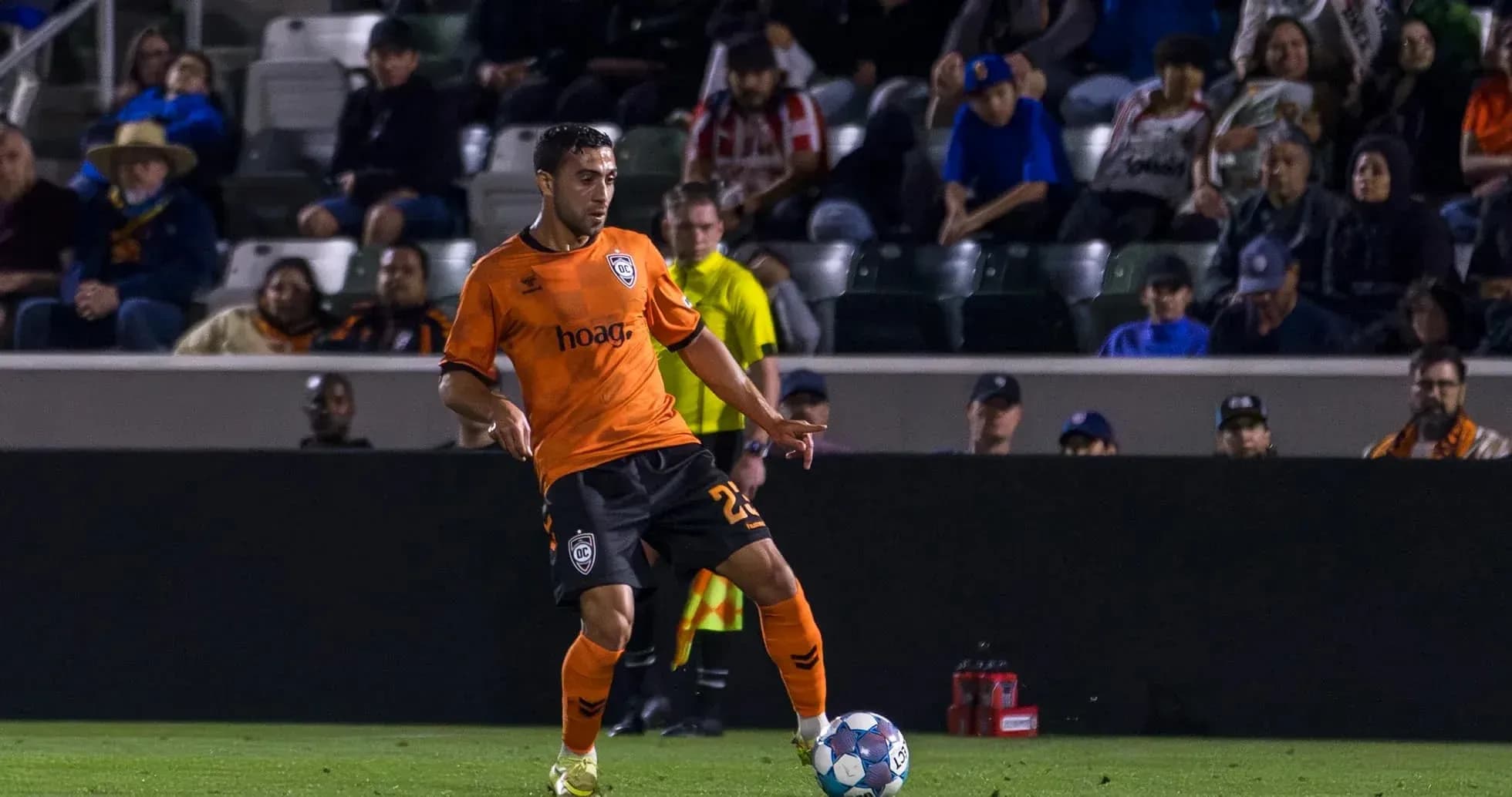 Orange County SC player dribbling the ball
