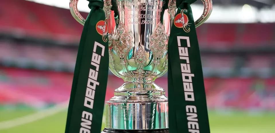 Carabao Cup trophy displayed on a green pedestal