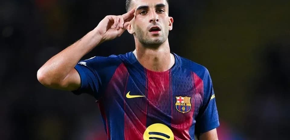 Player saluting during match in FC Barcelona jersey