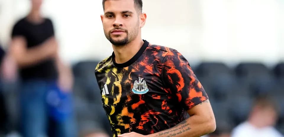 Player in Newcastle training kit during warm-up