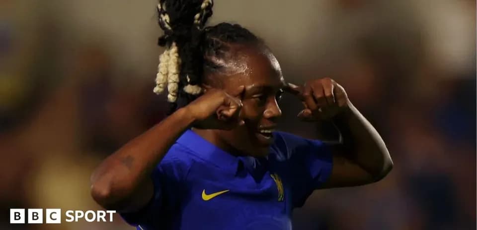 Chelsea player celebrating a goal with hand gestures