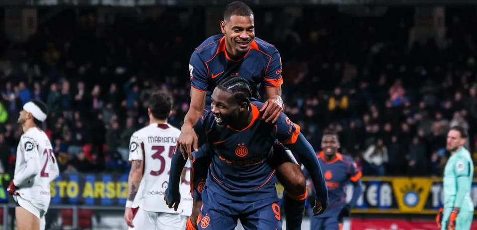 Players celebrating a goal on the field