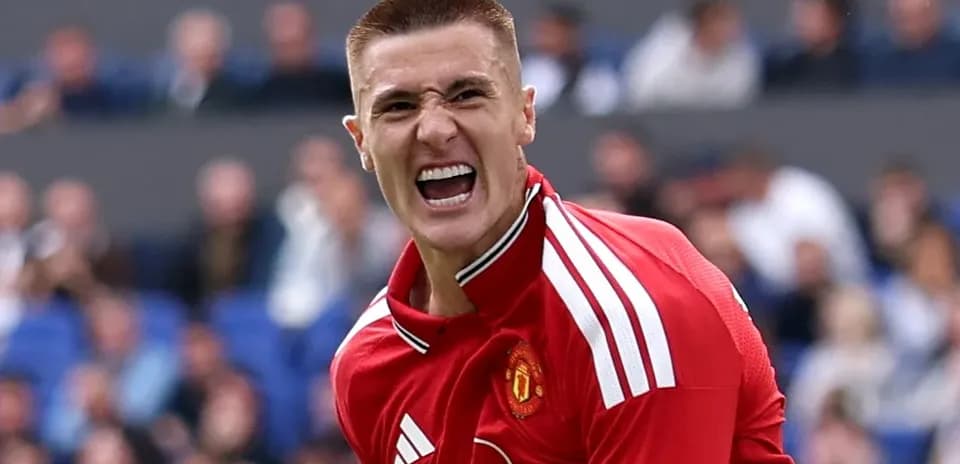 Player celebrating passionately in Manchester United jersey