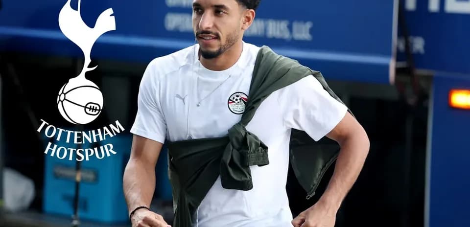 Player in training gear arriving at team bus