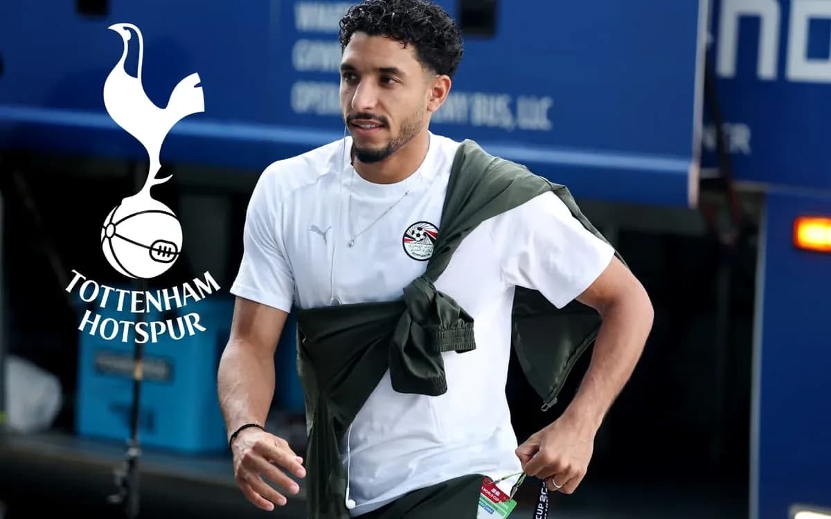 Player in training gear arriving at team bus
