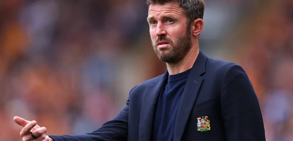 Coach gesturing during a match on the sidelines