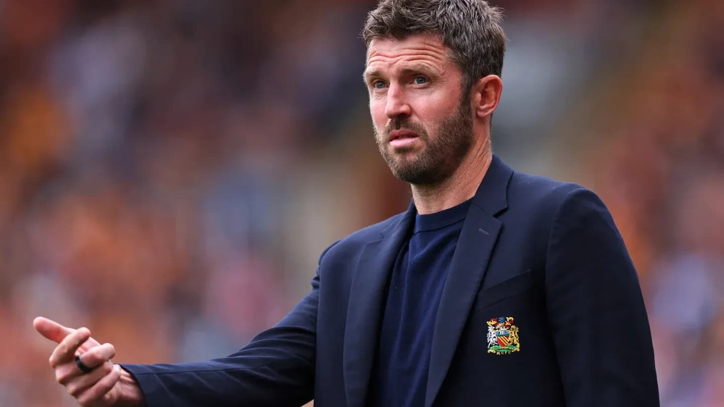 Coach gesturing during a match on the sidelines