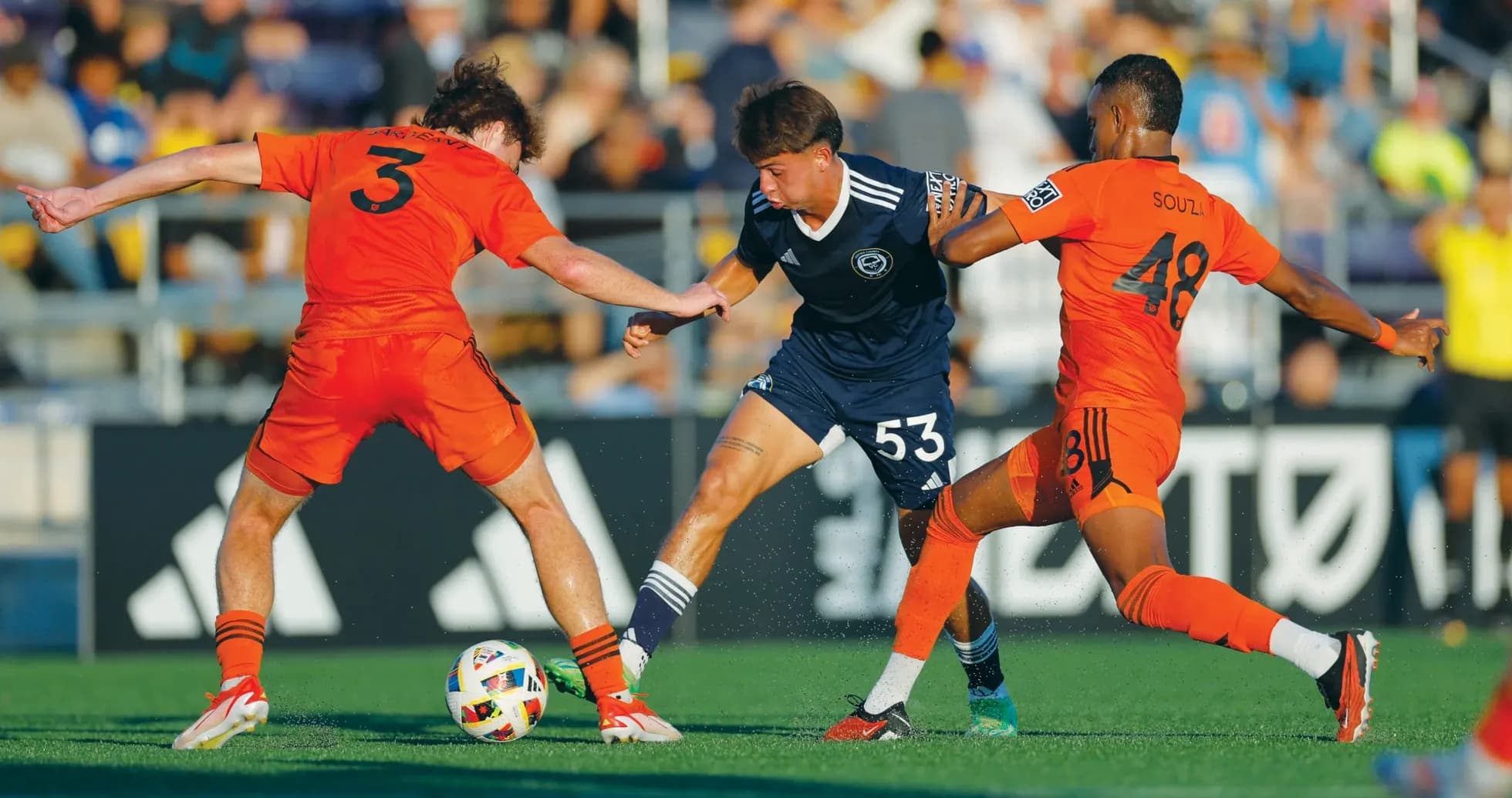 Players competing for the ball during match