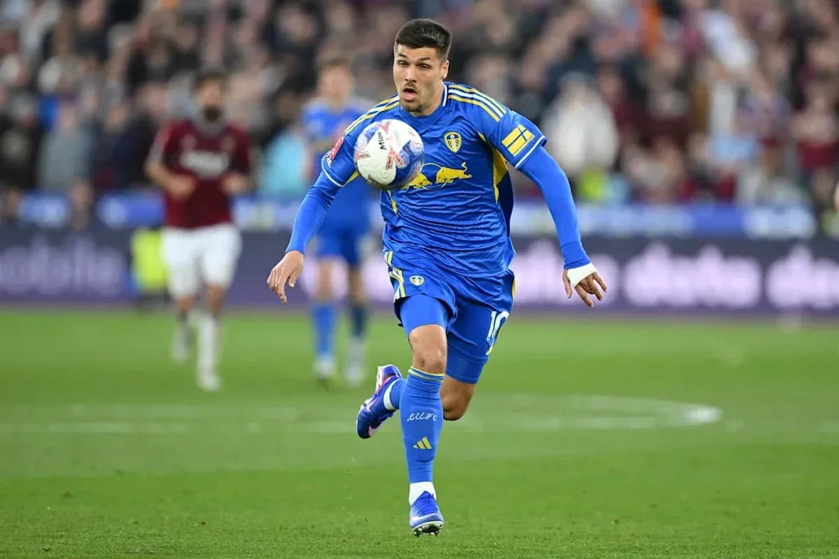 Player in blue jersey dribbling the ball during match