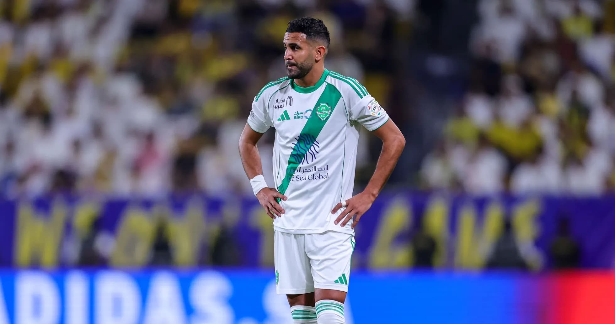 Player in green and white kit during match