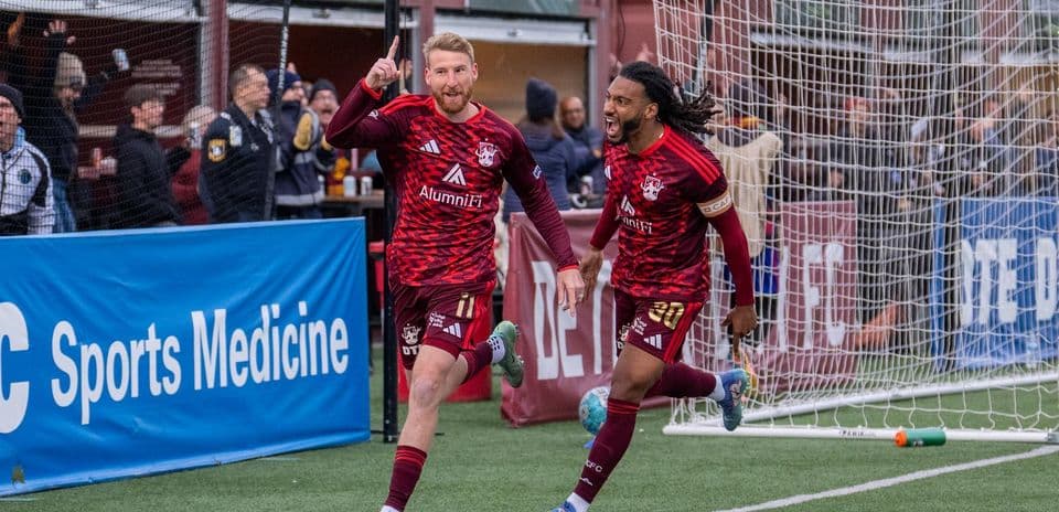 Players celebrating a goal during Detroit City match
