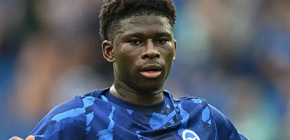 Player in blue kit during match action
