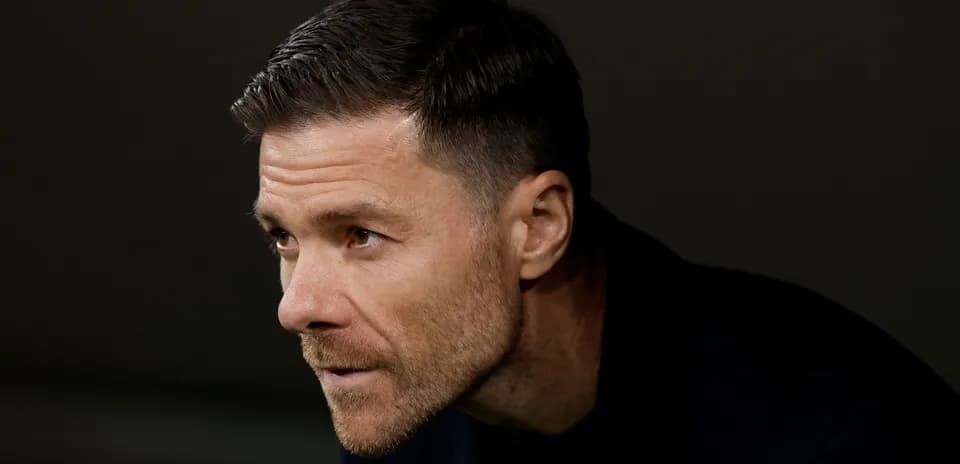 Coach observing from the sidelines during match