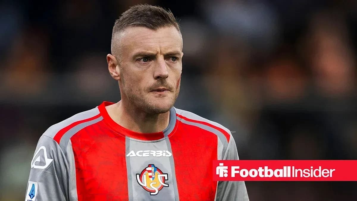Goalkeeper in red and gray kit on field