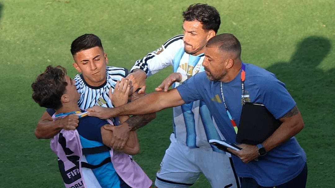 Players and coach involved in a confrontation on field