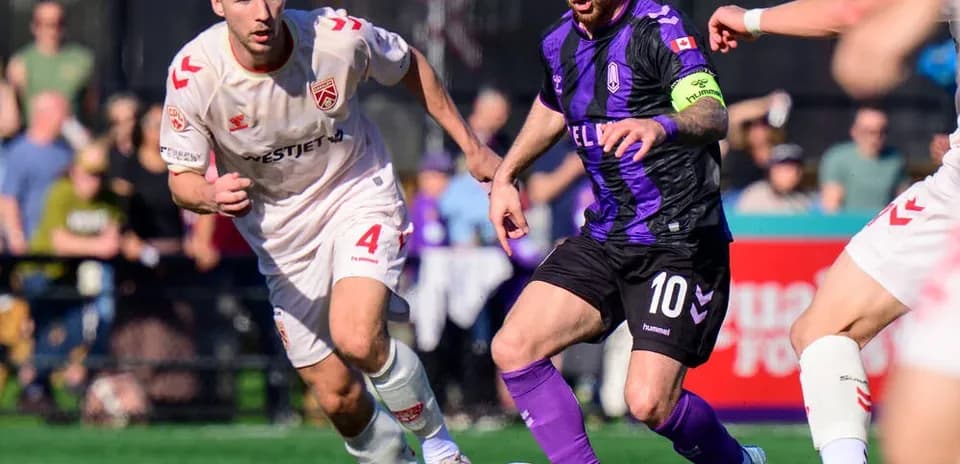 Cavalry FC player challenges Pacific FC opponent