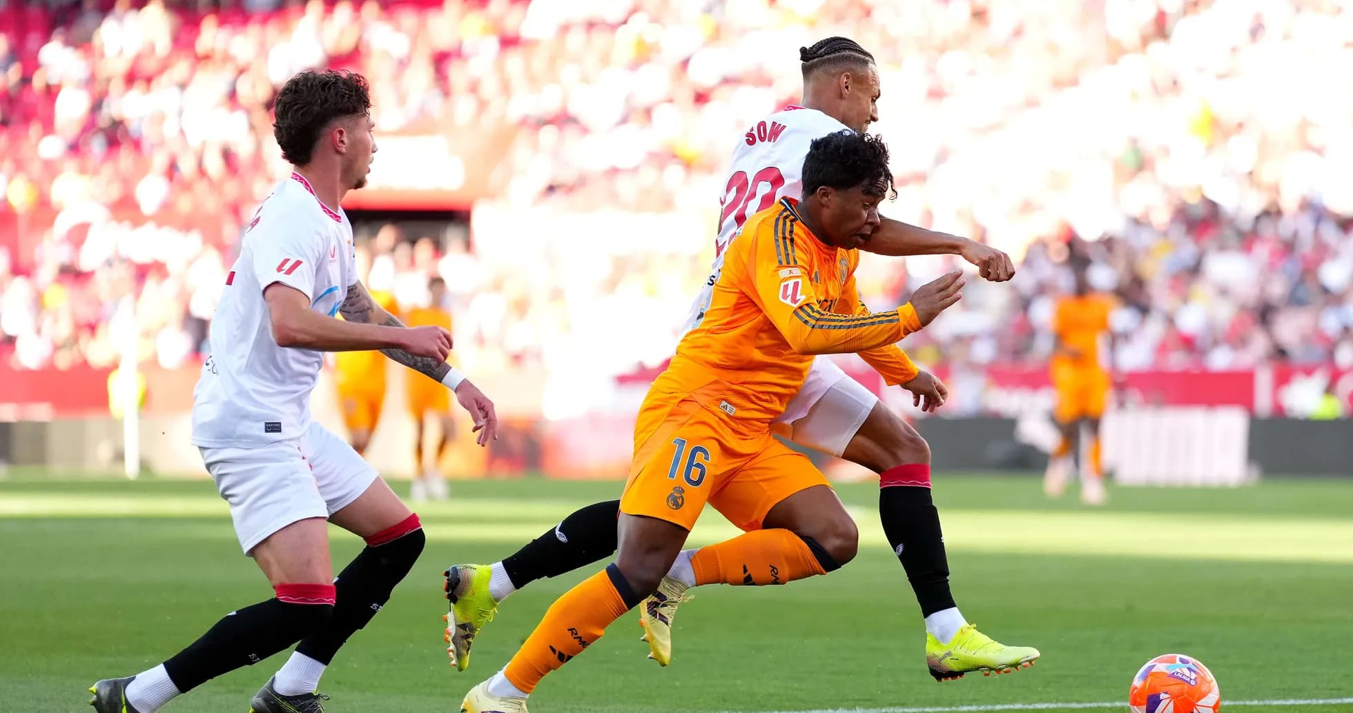 Players competing for the ball during Sevilla match