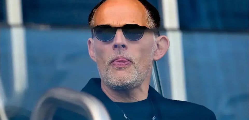 Man with sunglasses observing from a box