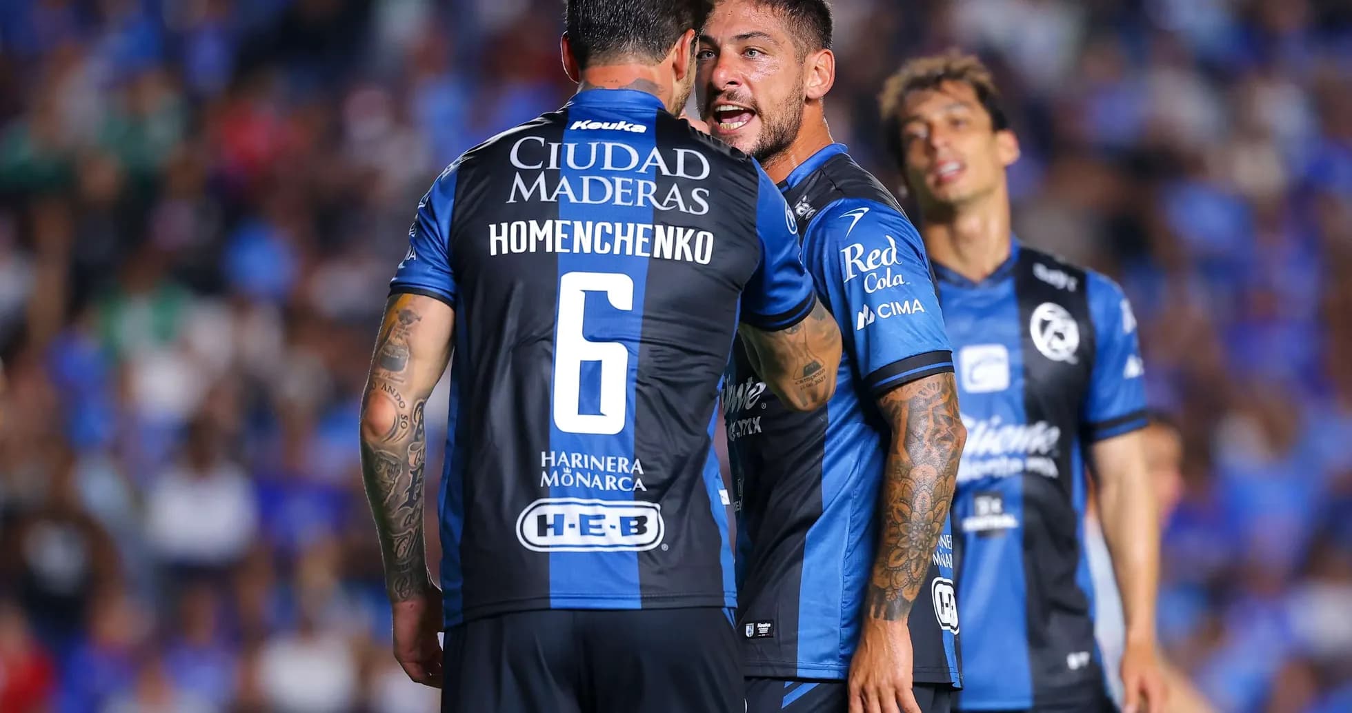 Players interacting during Liga MX match