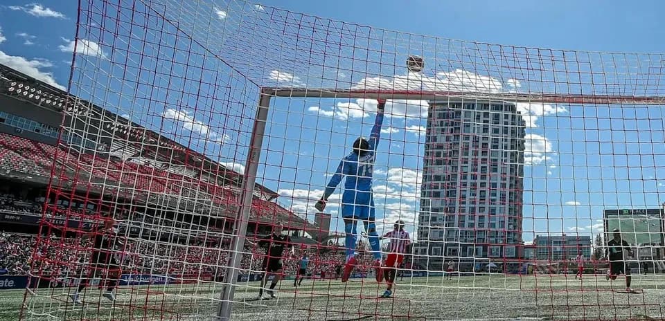 Goalkeeper making a save during Vancouver FC match