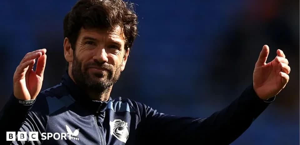 Coach gesturing during a match warm-up session