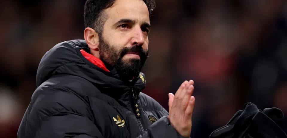 Coach applauding fans during a match