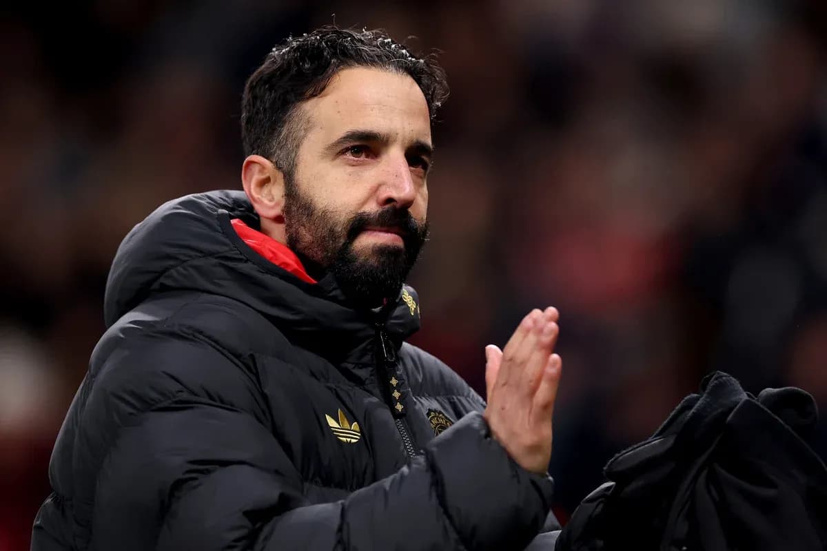 Coach applauding fans during a match