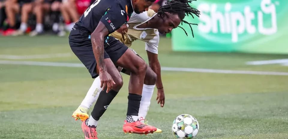 Players contesting for the ball during match