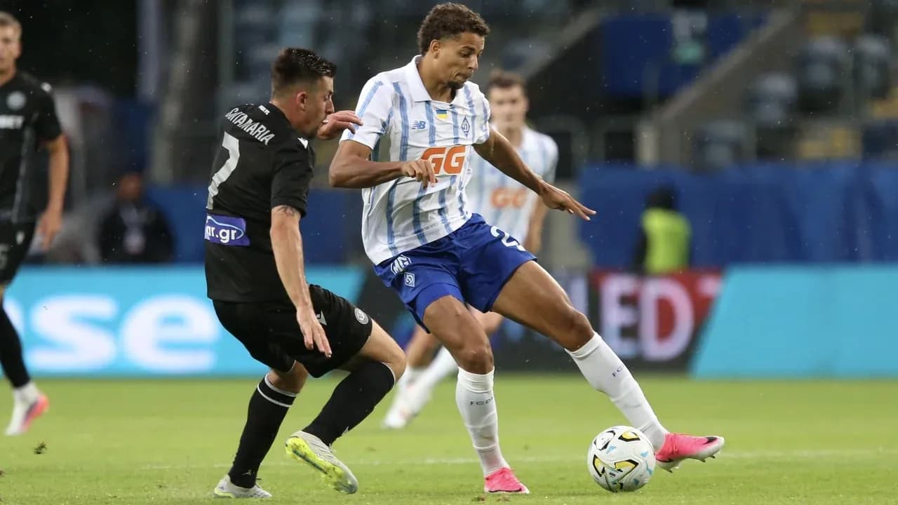 Two players competing during PAOK vs Dynamo Kyiv
