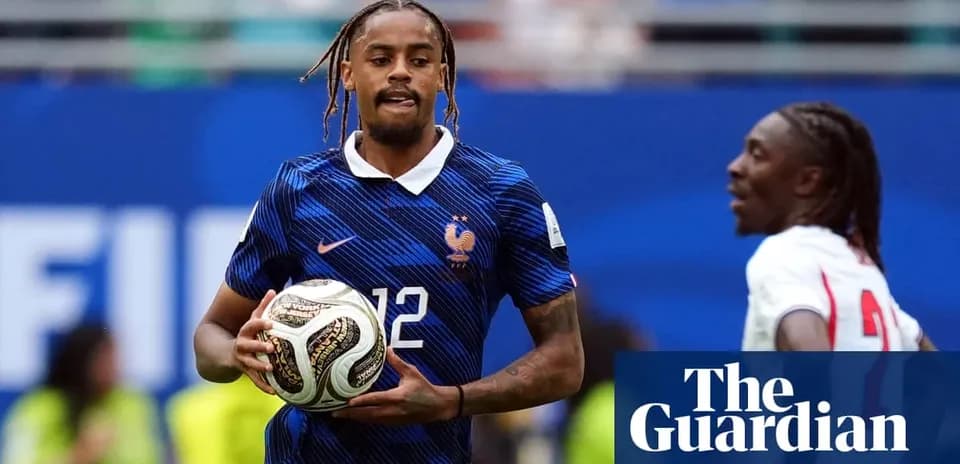 Player in France kit holding soccer ball during match