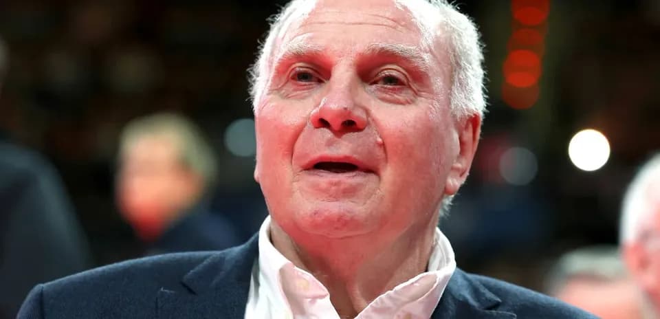 Elderly man in a suit at an event