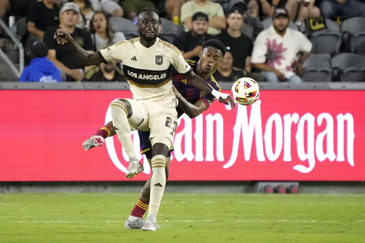 Players competing for the ball during match