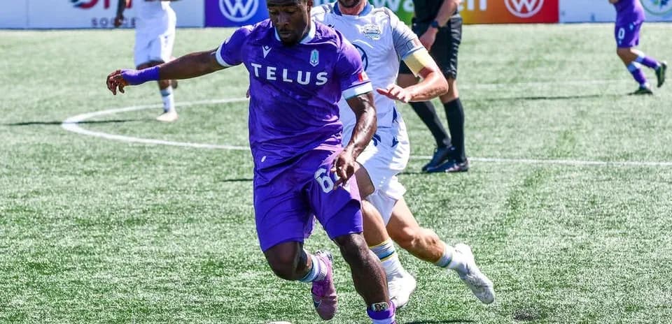 Player dribbling ball during Pacific FC match