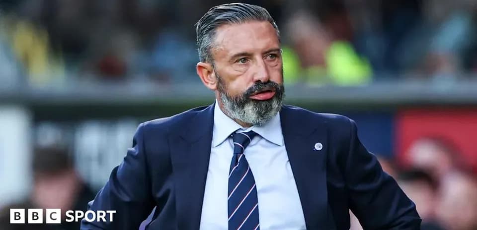 Football manager observing the match from sidelines