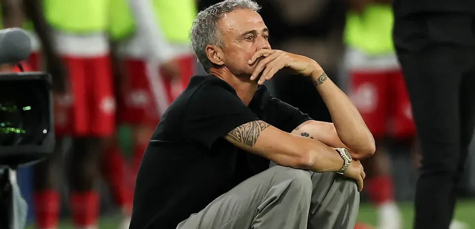 Coach sitting on the sideline during match
