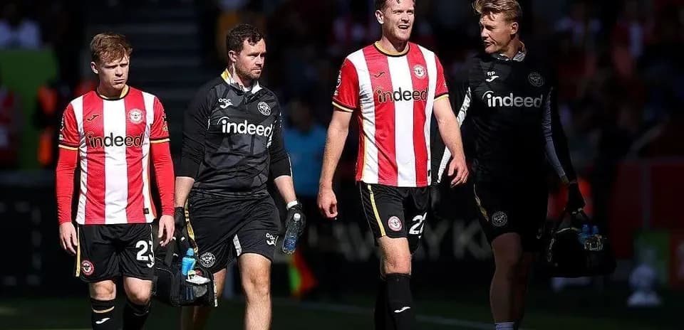 Brentford players walking off the pitch after match