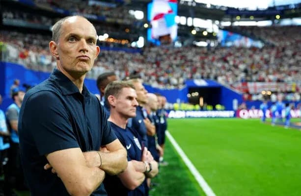 Coach observing match from the sidelines