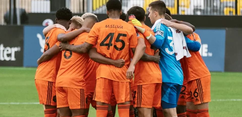 Houston Dynamo FC II players in team huddle