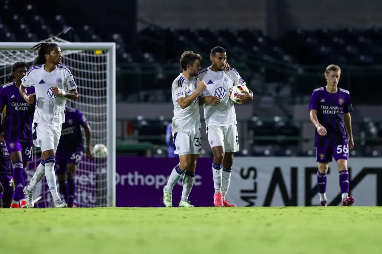 Players celebrating a goal during MLS Next Pro match