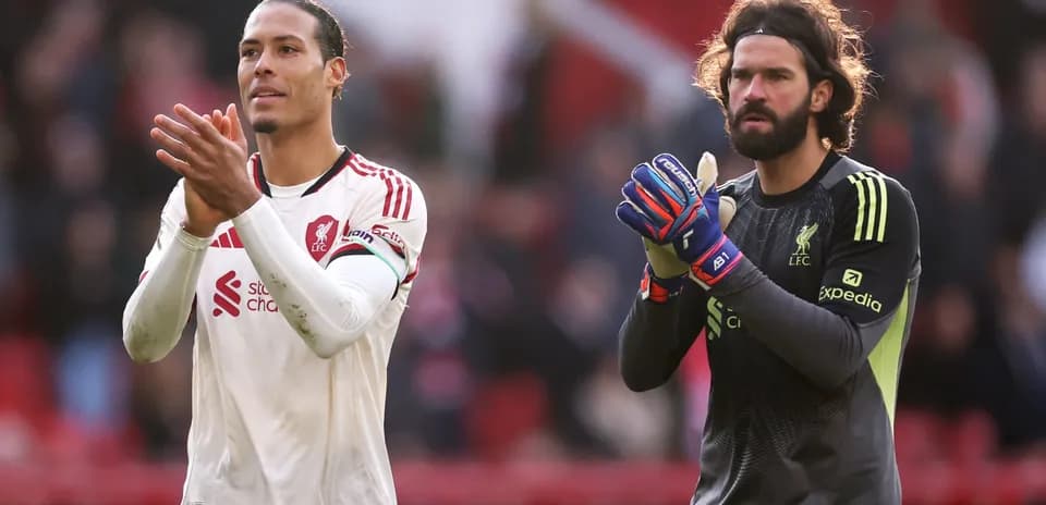 Liverpool players applauding fans after match