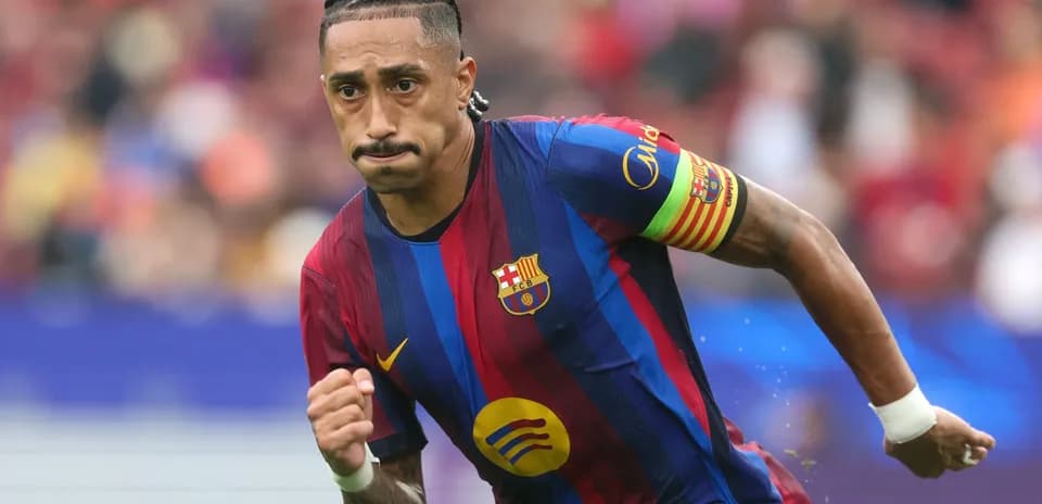 Player running on the field in FC Barcelona kit