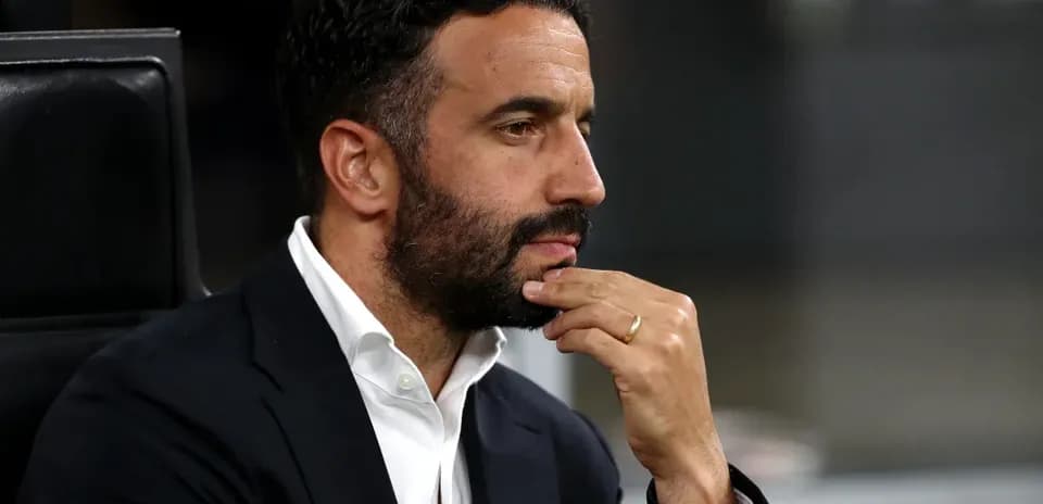 Coach deep in thought during a match