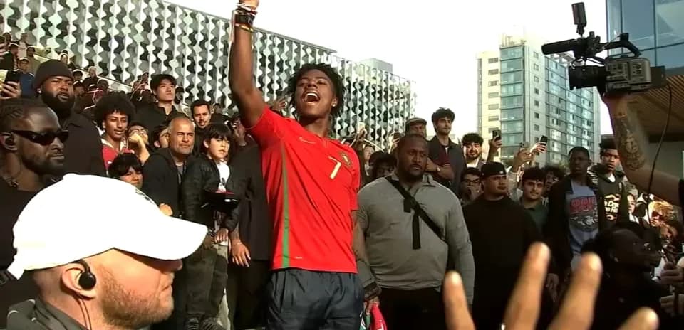 Fan celebrating in Portugal jersey during gathering