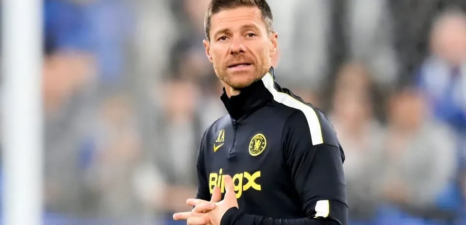 Coach giving instructions on the sidelines during match
