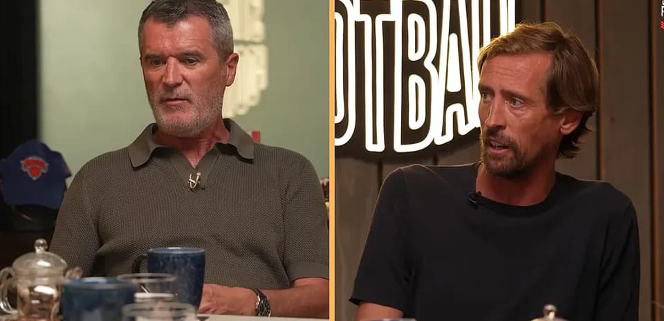 Two football pundits discussing at a table