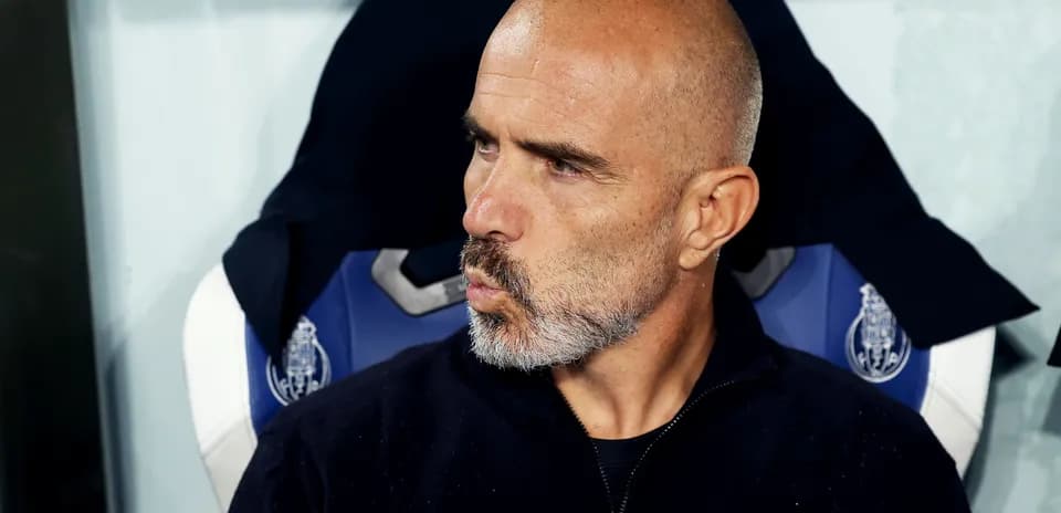Coach sitting on the bench during a match