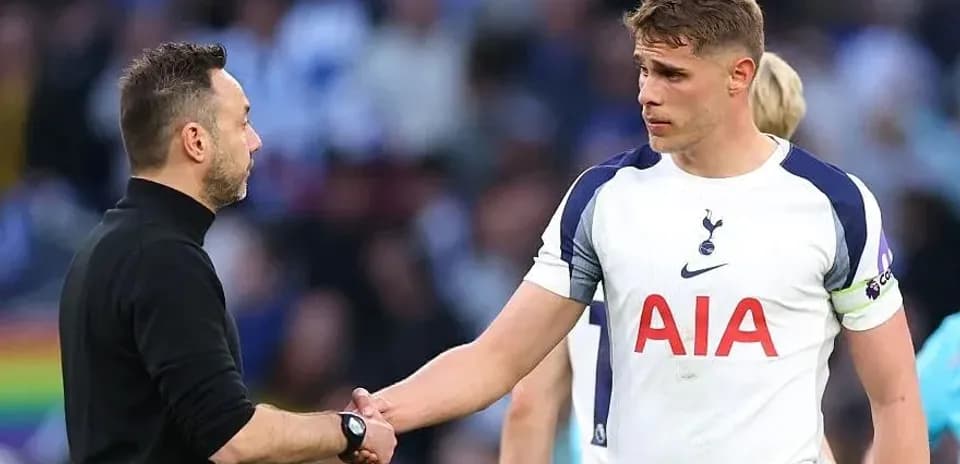 Coach and player shaking hands after match