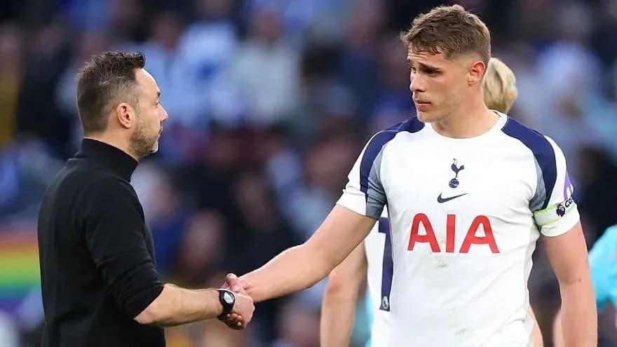 Coach and player shaking hands after match